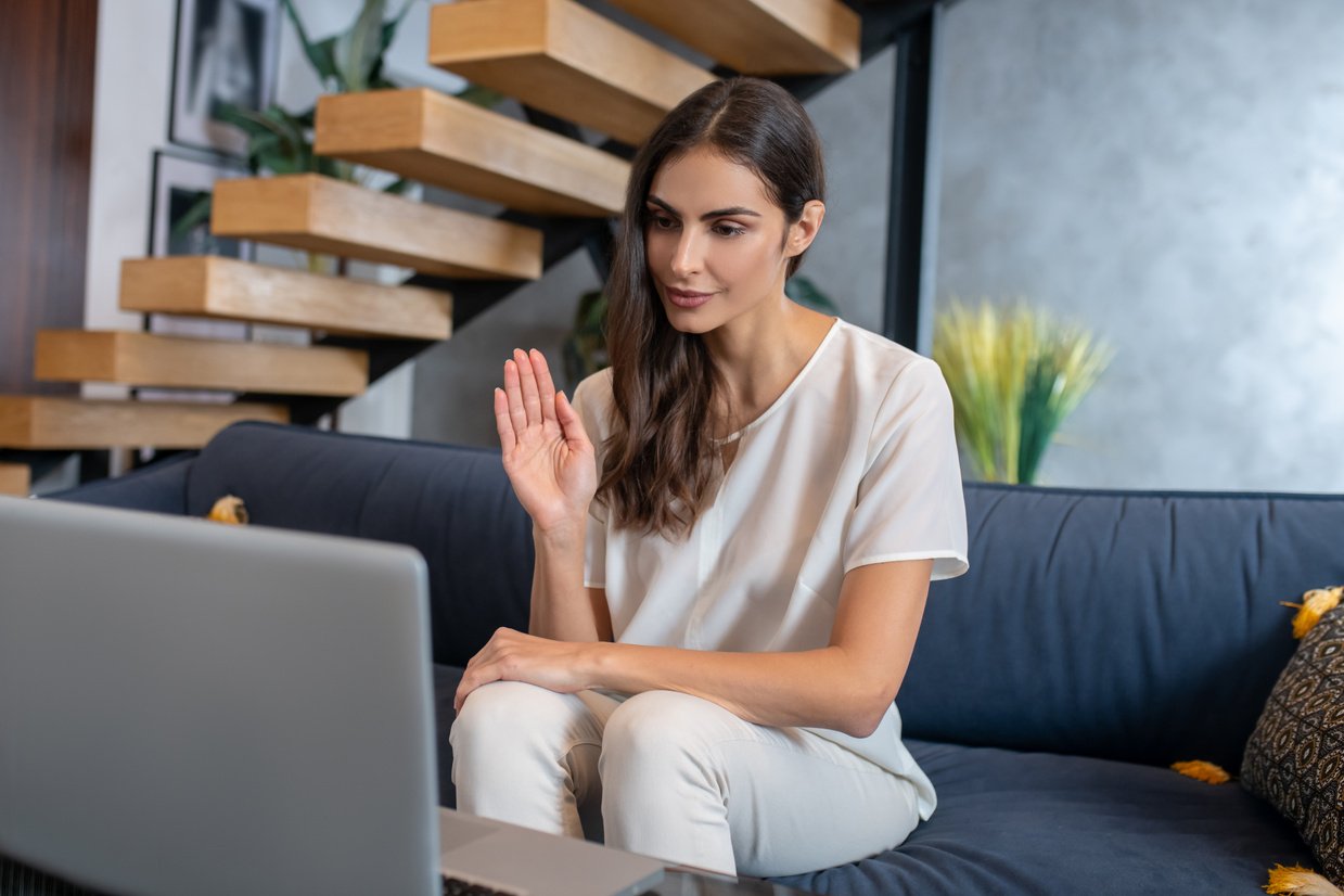 Woman having online therapy session with her therapist